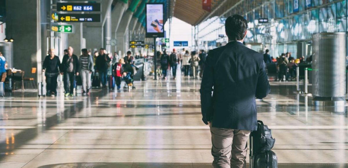 man walking through airport