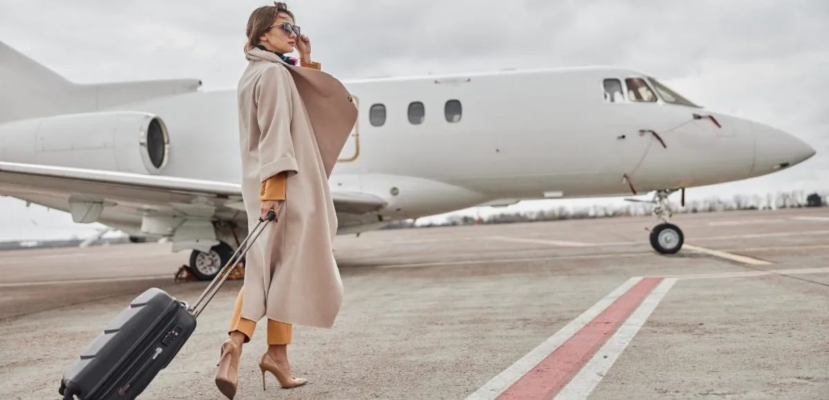 woman walking towards private jet