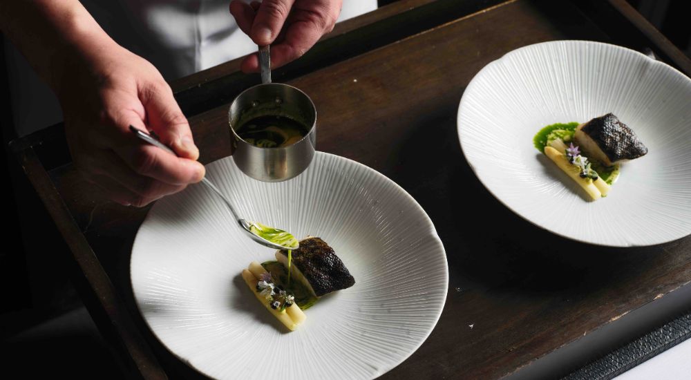Chef with fish sauce