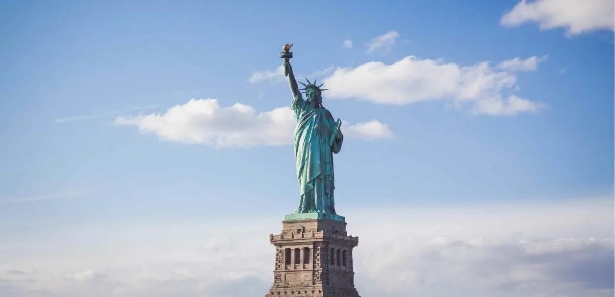 statue of liberty set against a blue sky