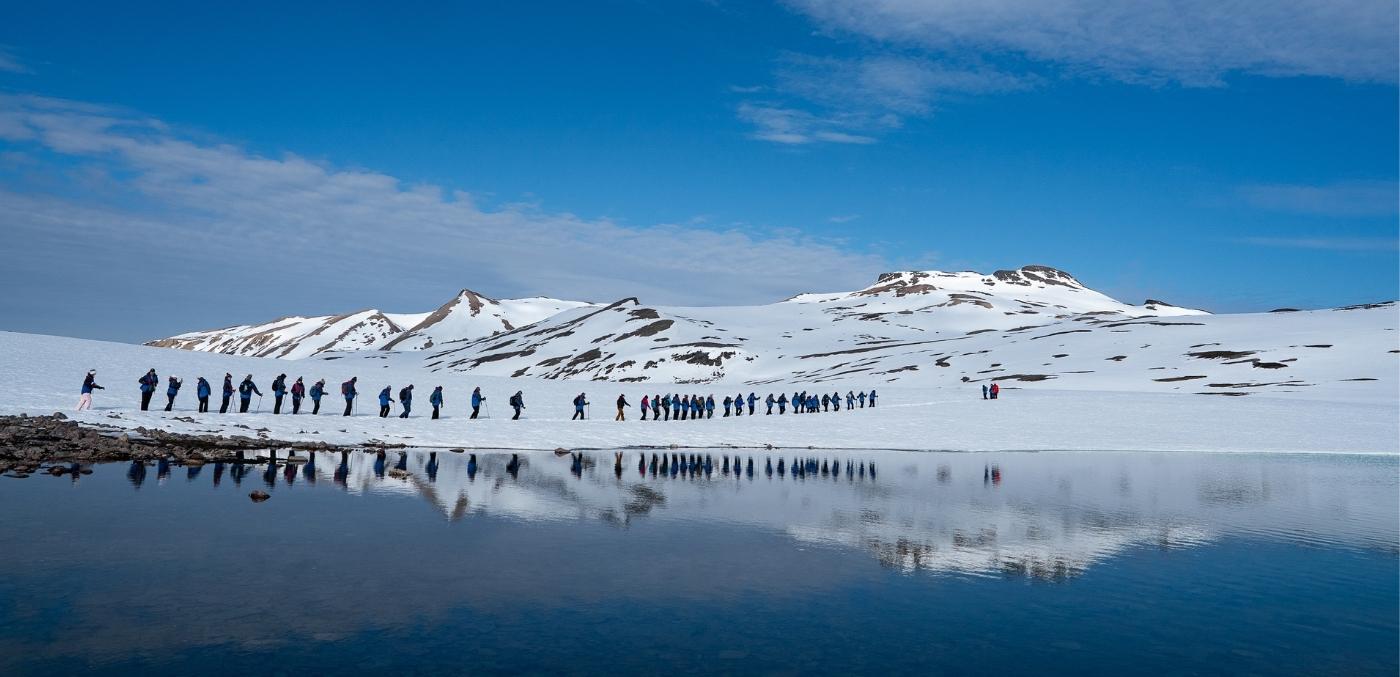 tour group hiking across ice plateau