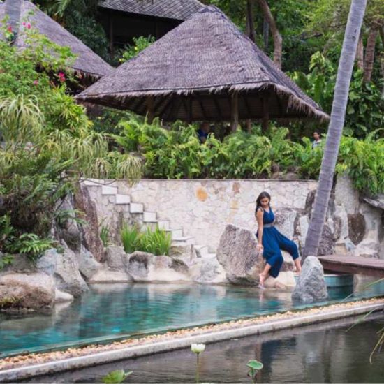 woman sitting by pool
