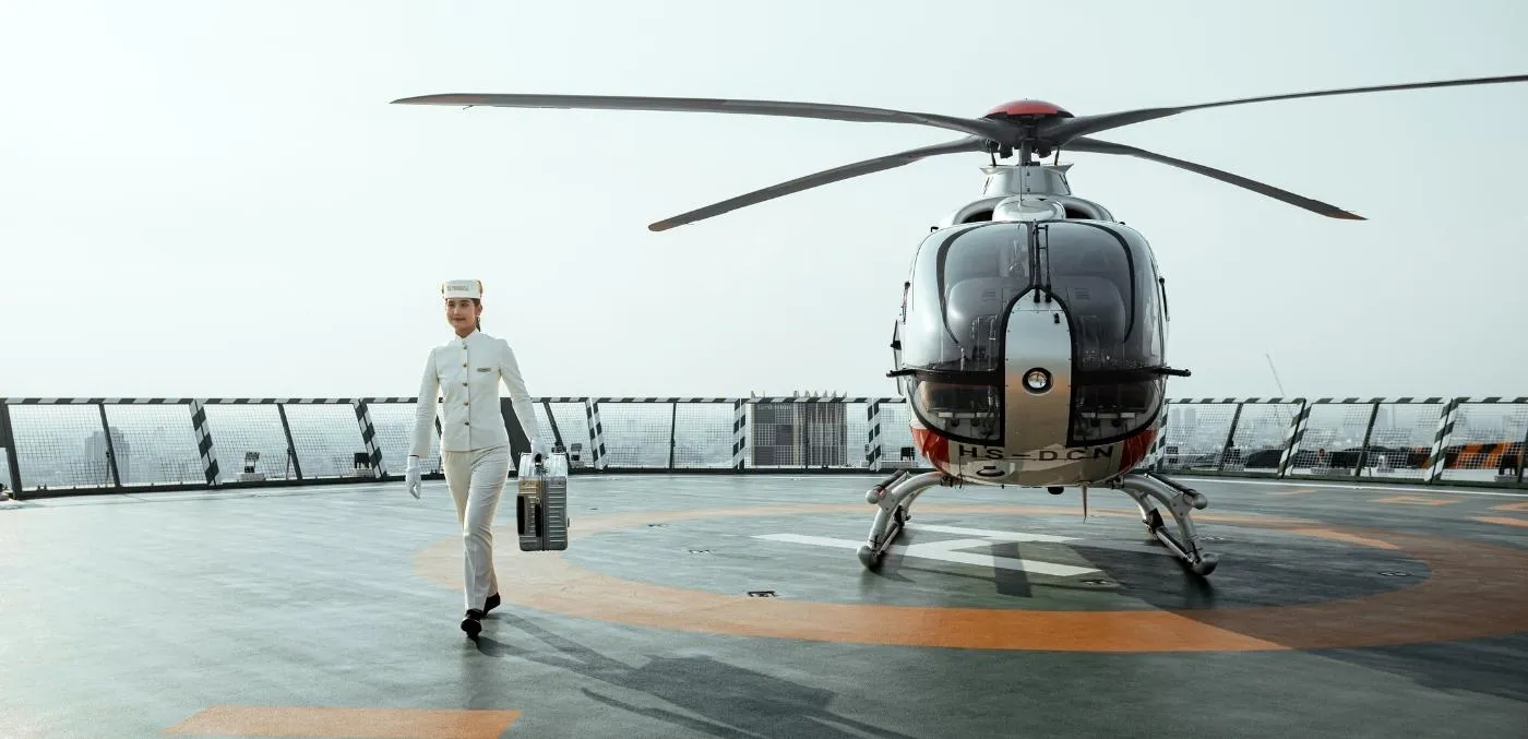 woman walking away from helicopter