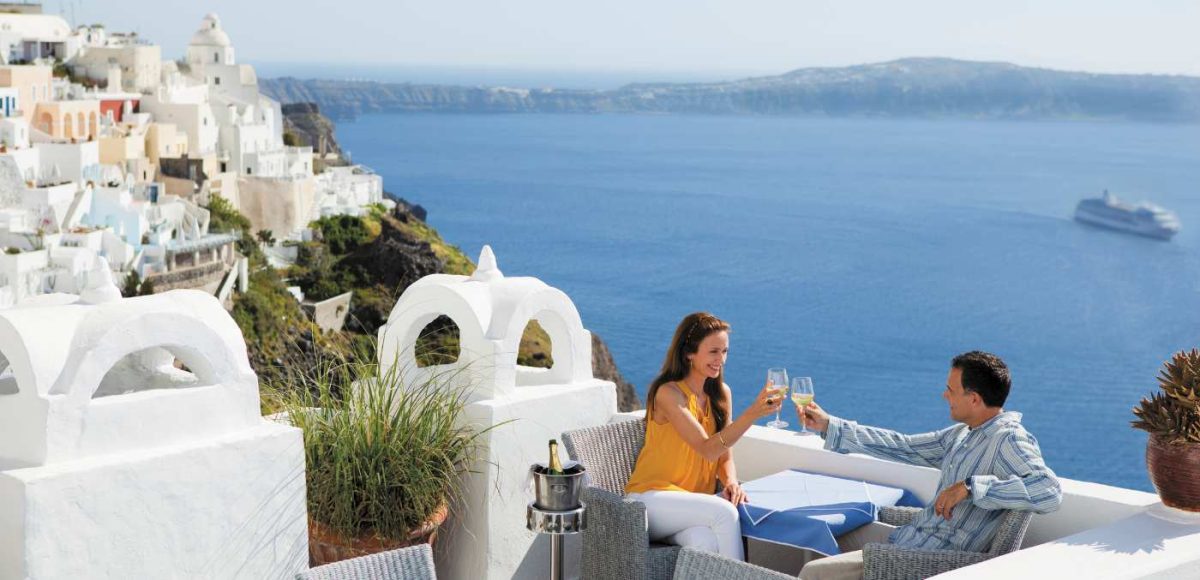 a couple having lunch in Santorini