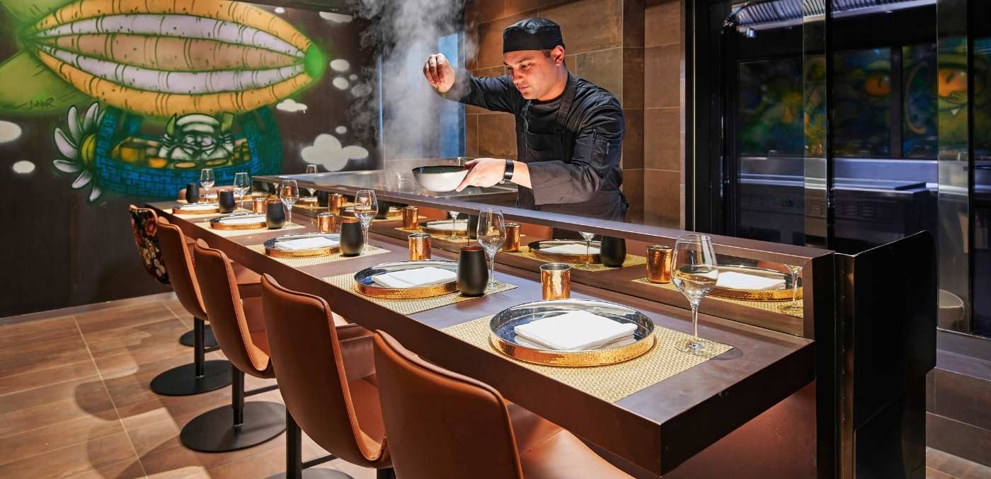 chef cooking over table